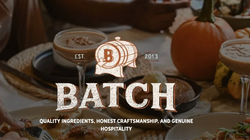 Batch logo over a fall-themed table with pumpkins and drinks, conveying hospitality and craftsmanship.