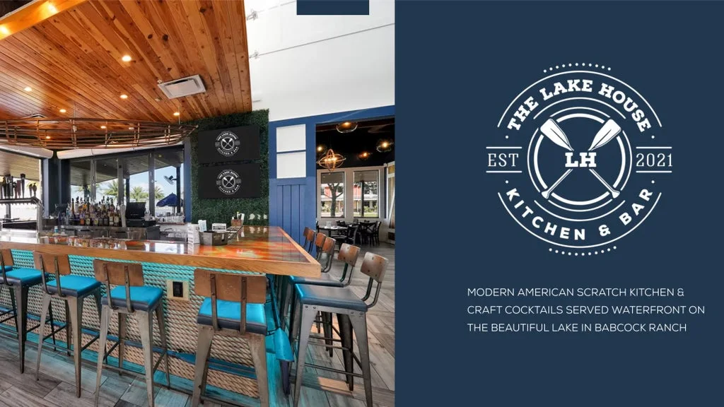 Bar area with a long wooden counter and turquoise stools, wooden ceiling, and a dark logo panel for The Lake House Kitchen & Bar on the right.