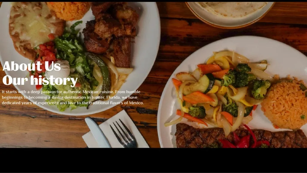 Hero image showing a spread of Mexican dishes on a wooden table, with overlaid text reading 'About Us Our history' for an About Us page.